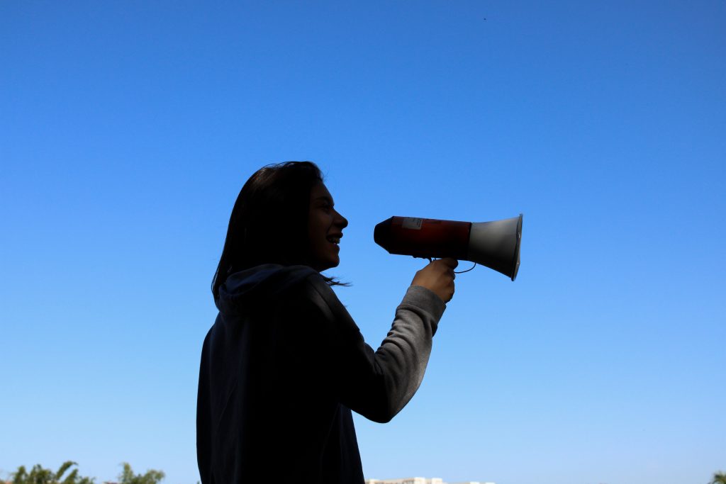 Person talking into a megaphone